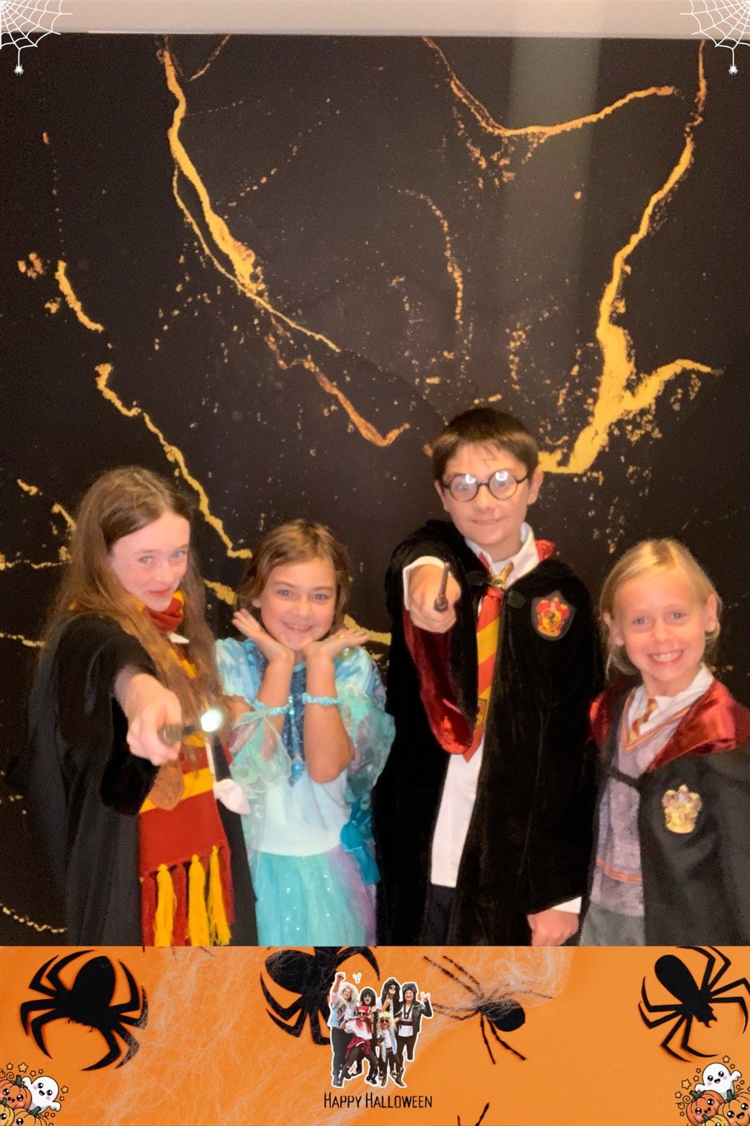Group of kids in costumes smiling at an open-air photo booth at a private family Halloween party in Arnold, Maryland Group of kids in costumes smiling at an open-air photo booth at a private family Halloween party in Arnold, Maryland