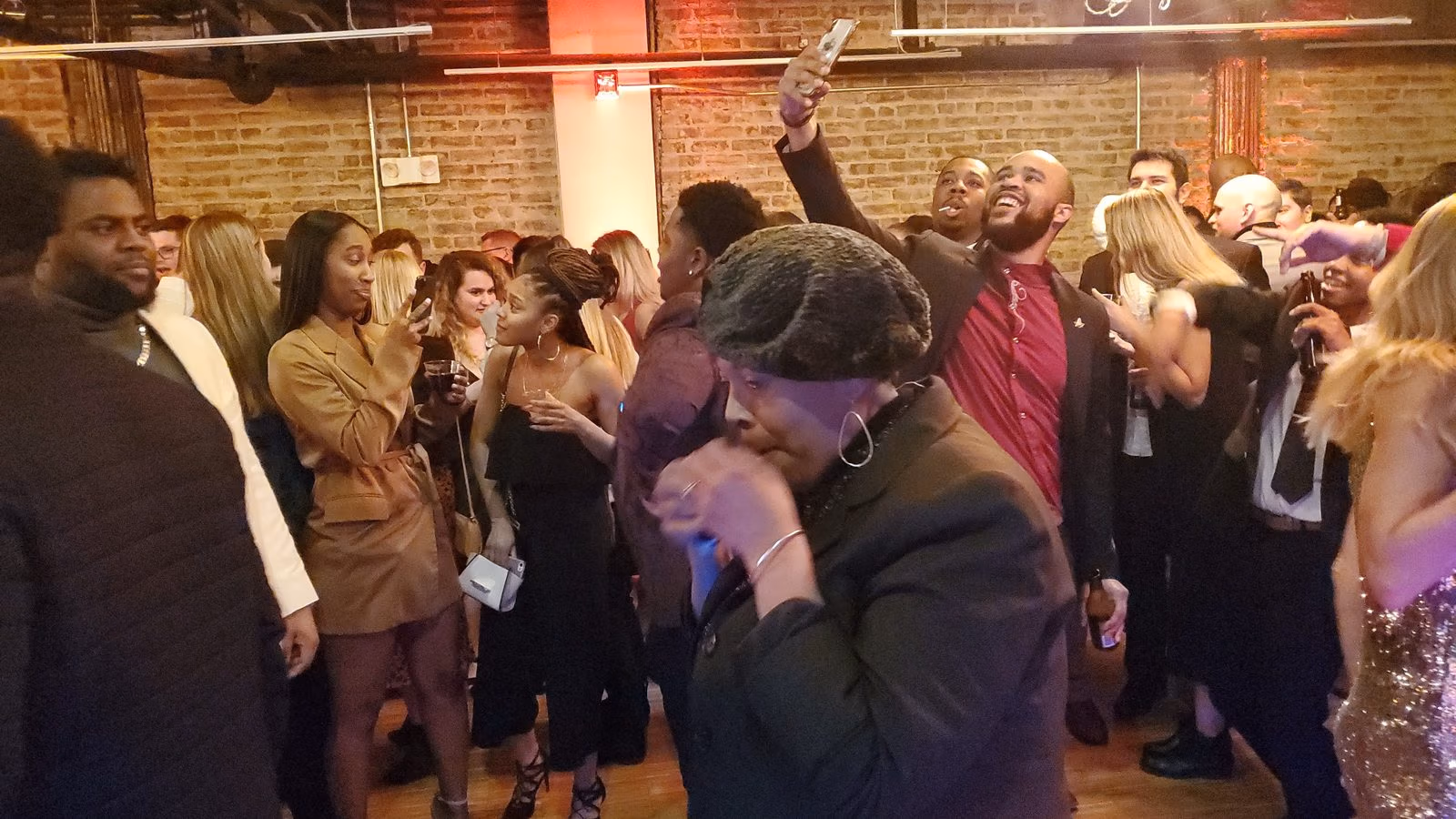 Corporate holiday party DJ in the DMV: coworkers dancing as a Knightrin DJ sets the energy